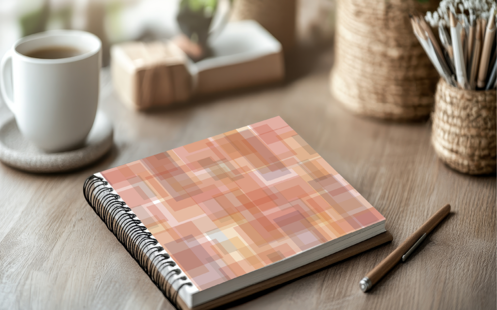 Client: Goosby Twins Stainglass cover art on planner sitting on neutral desk